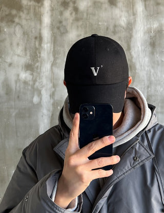 V , ball cap