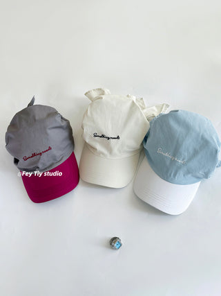 striped baseball cap