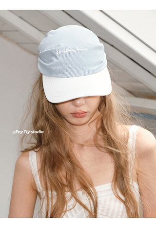 striped baseball cap