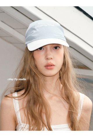 striped baseball cap