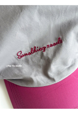 striped baseball cap