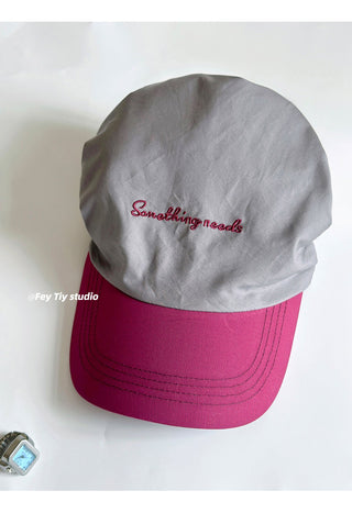 striped baseball cap