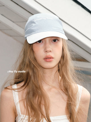 striped baseball cap