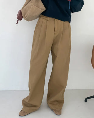 Wide-leg pants with buckle pleats