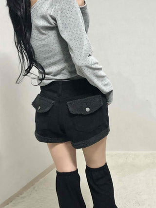 High-waisted denim shorts with hemline frill detail