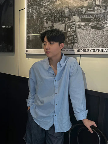 blue draped shirt