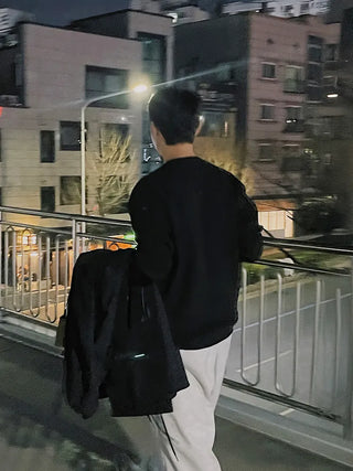 black round sweater