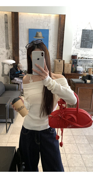 white off-shoulder sweater