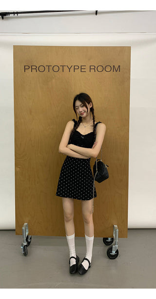 black polka-dot dress