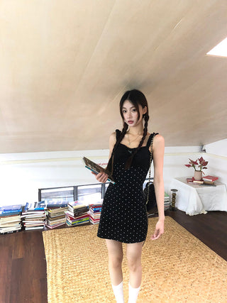 black polka-dot dress