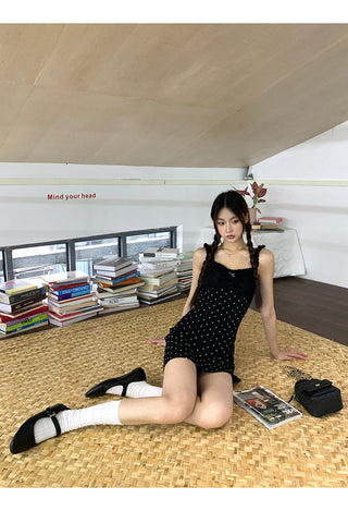 black polka-dot dress