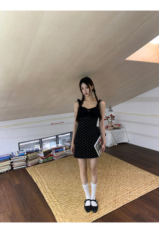black polka-dot dress