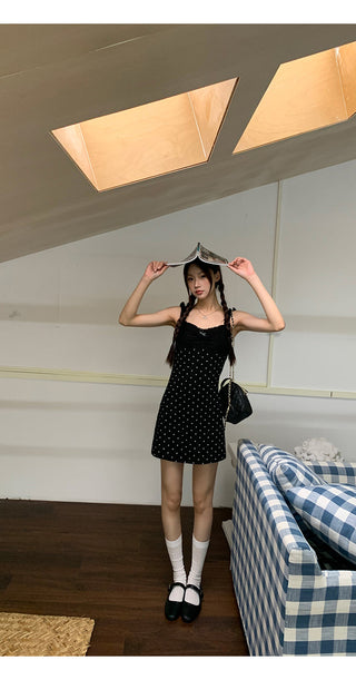 black polka-dot dress
