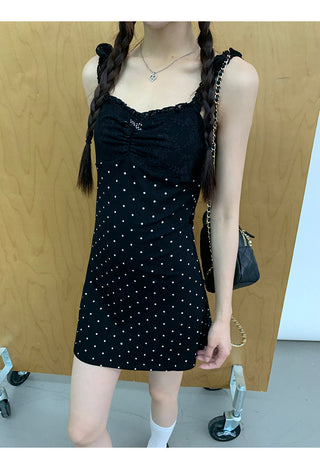 black polka-dot dress