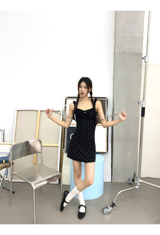 black polka-dot dress
