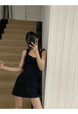 black polka-dot dress
