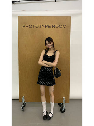 black polka-dot dress