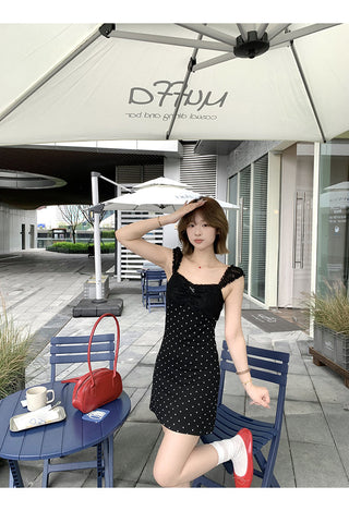 black polka-dot dress