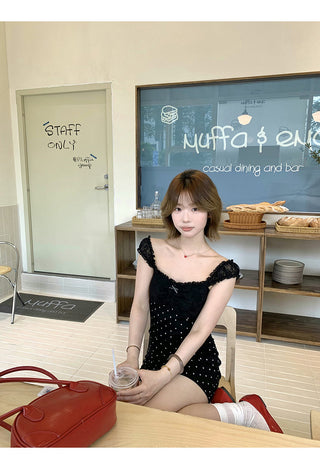 black polka-dot dress