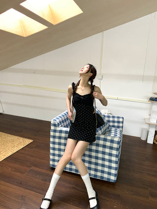 black polka-dot dress