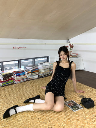 black polka-dot dress