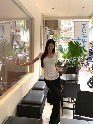 white V-neck top