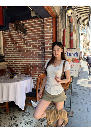 white V-neck top