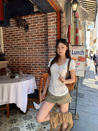 white V-neck top
