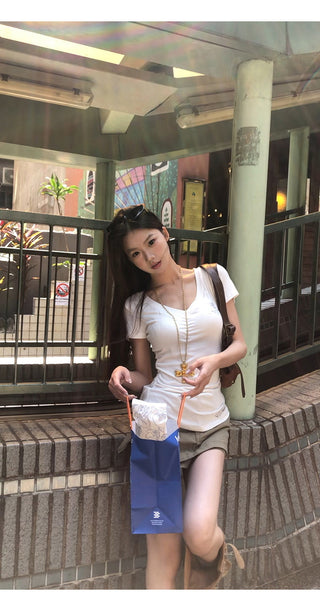 white V-neck top