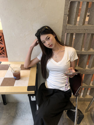 white V-neck top