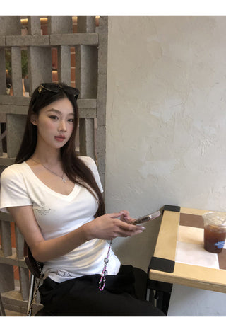white V-neck top