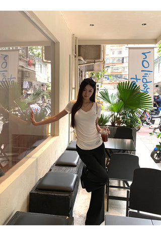 white V-neck top