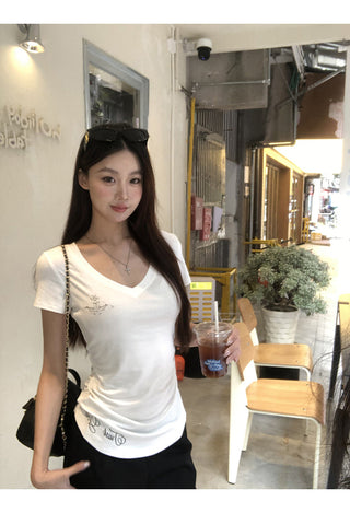 white V-neck top