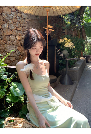 green figure-flattering dress