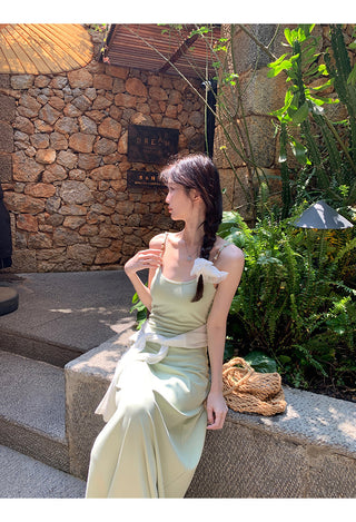 green figure-flattering dress