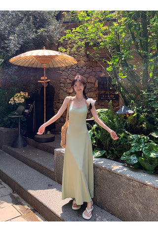 green figure-flattering dress