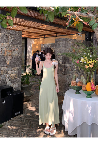 green figure-flattering dress