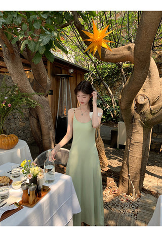 green figure-flattering dress