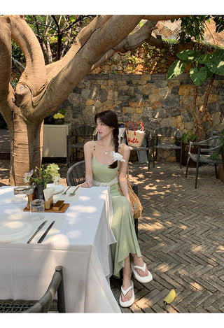 green figure-flattering dress