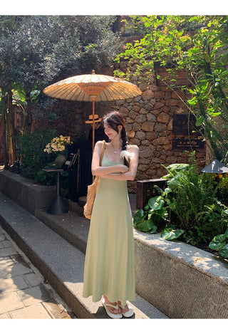 green figure-flattering dress