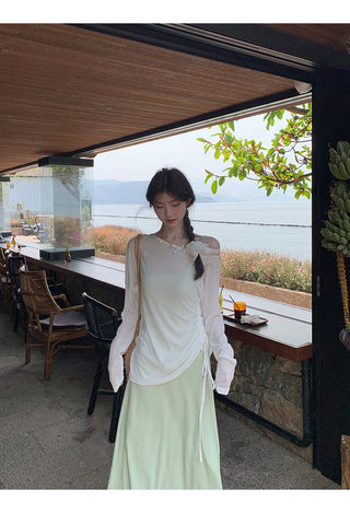 green figure-flattering dress