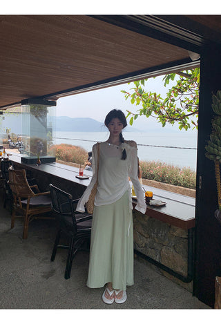 green figure-flattering dress