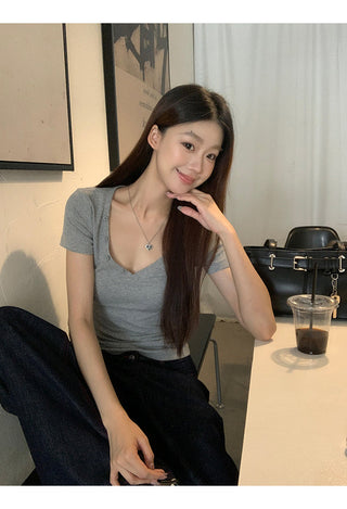 gray V-neck top