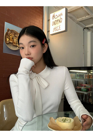 white long sleeve top