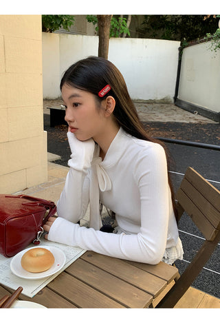 white long sleeve top