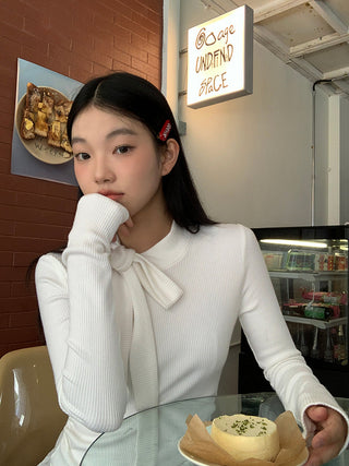 white long sleeve top