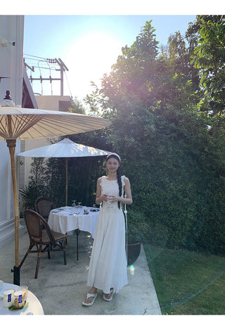 white sleeveless dress
