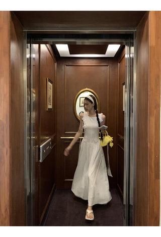 white sleeveless dress