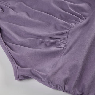 Sleeveless high neck knotted ruched top