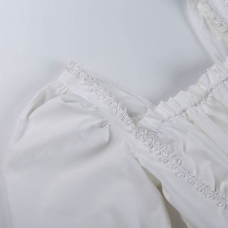 Long sleeve smocked lace up lace hem mini dress